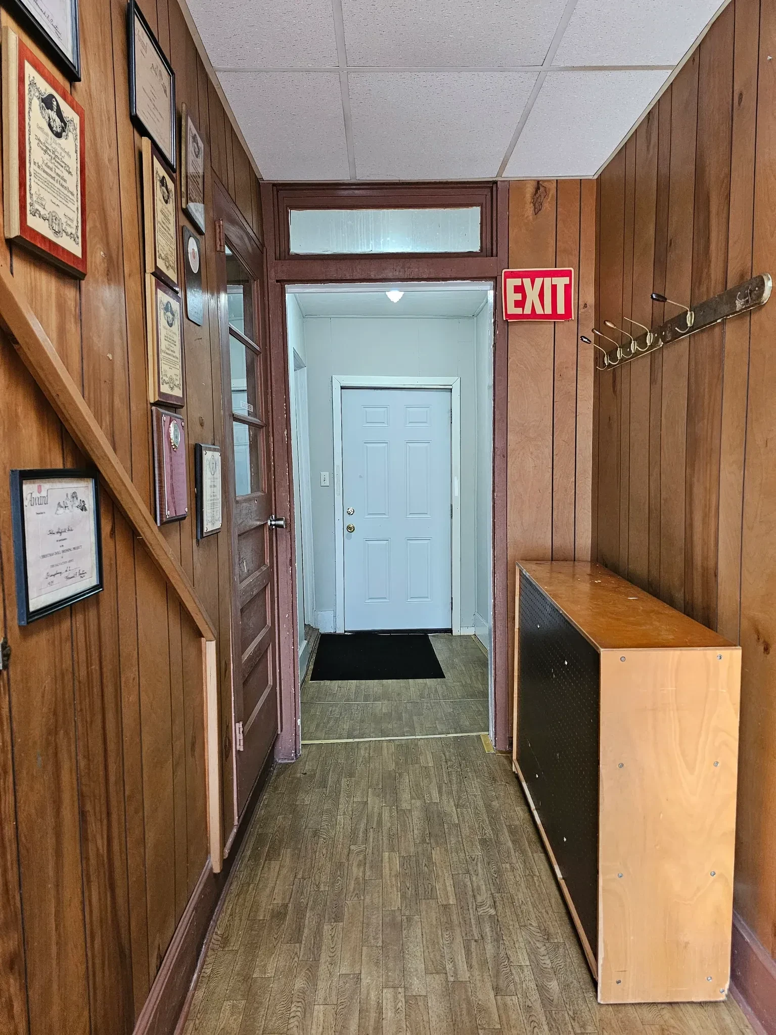 Hallway with framed certificates inside the Sunlight Community Center